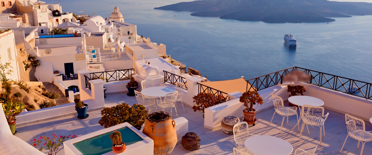 European ocean and mountain view with white buildings