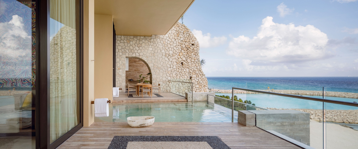 View from a deck at an all-inclusive resort with a private plunge pool overlooking the ocean 